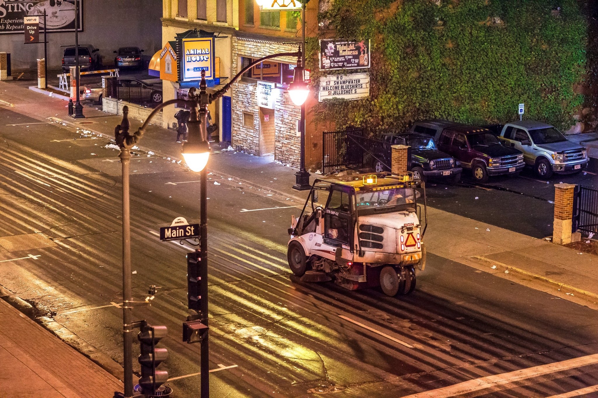 A street cleaner attempts to wash away all that was from the 57th Annual La Crosse Oktoberfest.